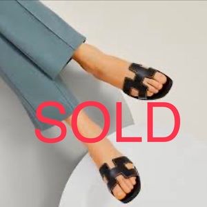 SOLD Hermés Oran Sandals ( well loved black leather, ecru sole )